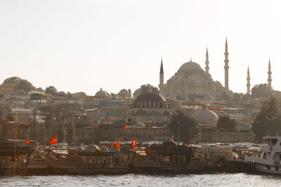 Panoramic view of buildings and city against clear sky