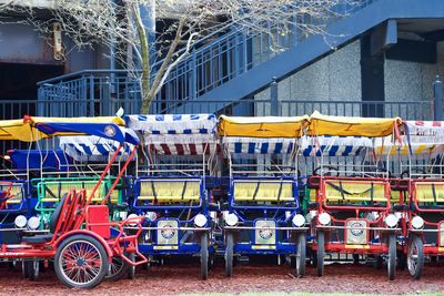 Pedicabs parked by staircase