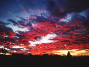 Low angle view of dramatic sky during sunset