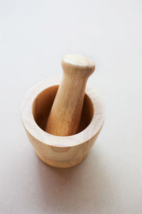 Close-up of wooden mortar and pestle on table