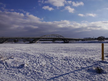 Scenic view of bridge against sky during winter