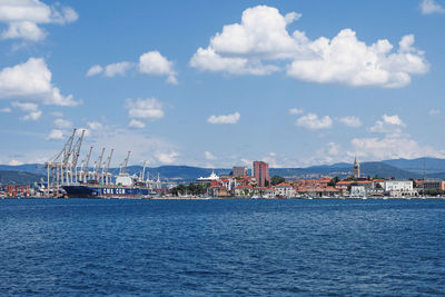 Scenic view of sea against blue sky during sunny day