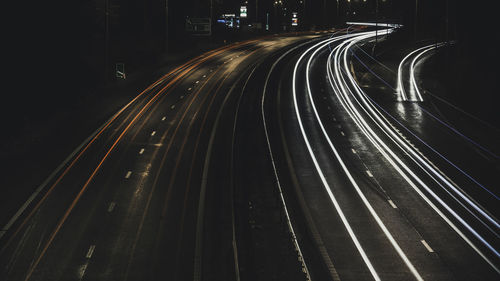 Light trails on road in city at night