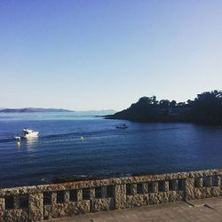 Scenic view of calm sea against clear sky