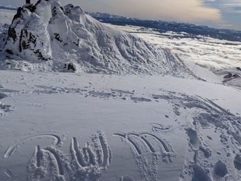 Scenic view of snow covered mountain against sky