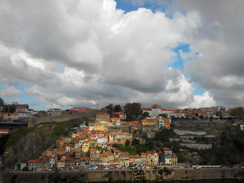 Town against cloudy sky