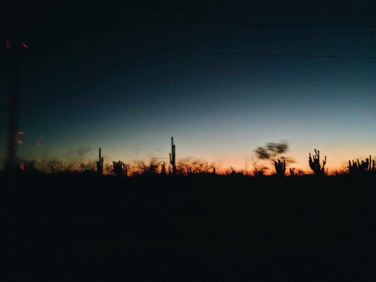 SILHOUETTE FIELD AGAINST CLEAR SKY