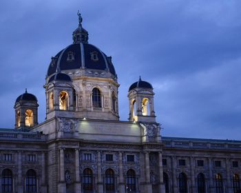 Low angle view of building against cloudy sky