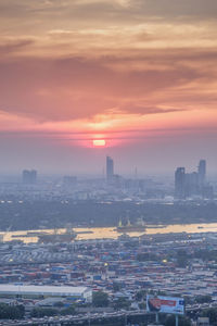 High angle view of buildings against sky during sunset