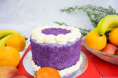Close-up of cake and fruits on table during christmas