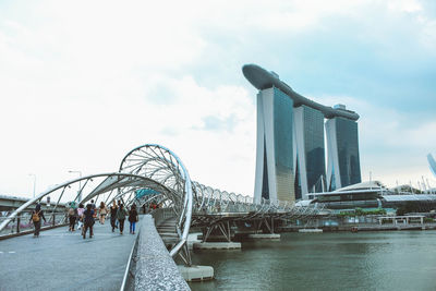 Group of people in front of bridge