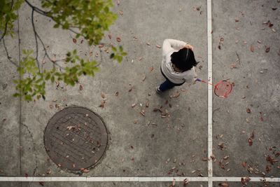 High angle view of girl playing badminton