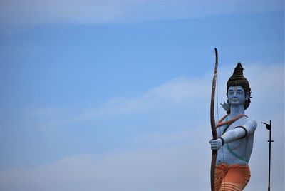 Low angle view of statue against sky