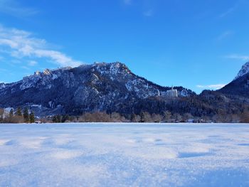 Scenic view of frozen lake against mountains