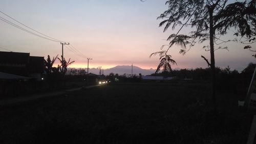 Silhouette landscape against sky during sunset