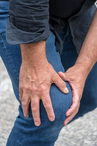 Midsection of man with hands