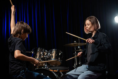 Young man playing in music concert