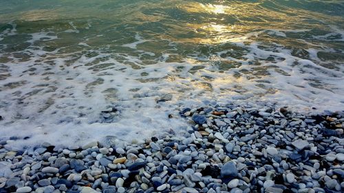 High angle view of stones on beach