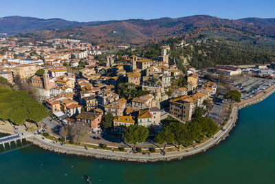 Aerial view of passignano sul trasimeno, a small town along the lake near perugia, 