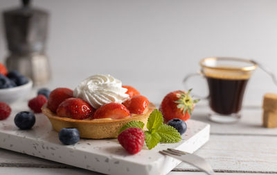 Close-up of fruits in plate on table