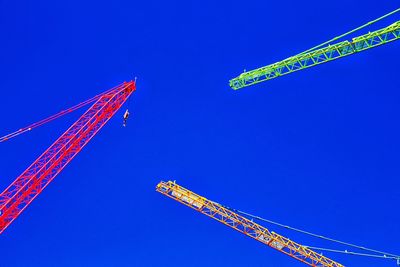 Low angle view of vapor trail against clear blue sky