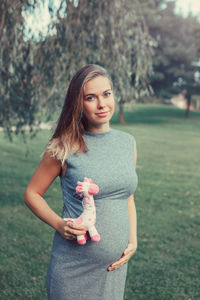 Young woman standing on field