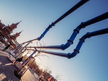 Low angle view of amusement park against clear sky