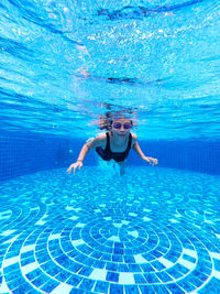 Woman swimming in pool