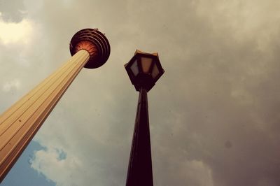 Low angle view of communications tower against sky