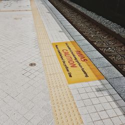 High angle view of text on railroad platform