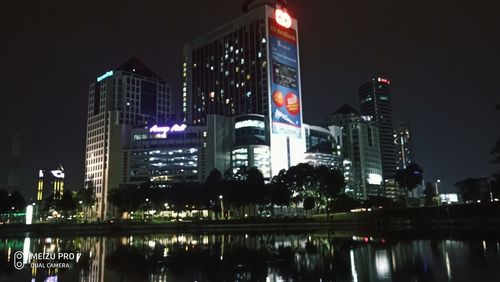 Reflection of buildings in city at night