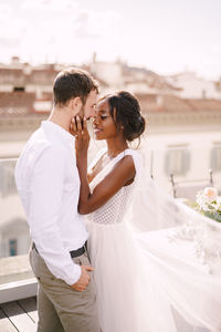 Rear view of couple standing outdoors