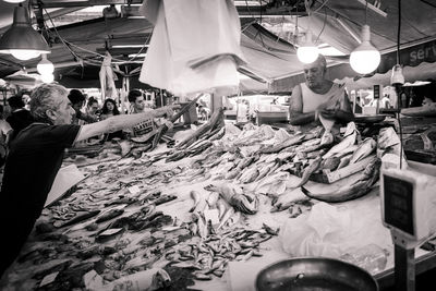 People at market stall