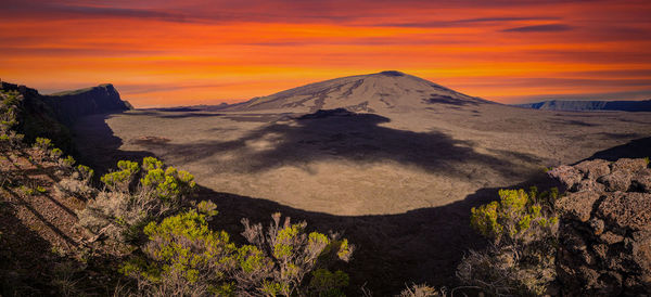 Scenic view of mountains against sky during sunset