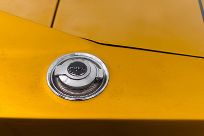 Close-up of fuel tank on yellow car