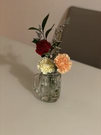 Close-up of flower vase on table