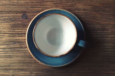 High angle view of empty coffee cup on table