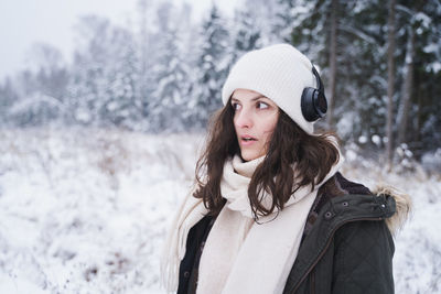 Portrait of young woman in snow