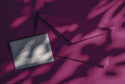 High angle view of envelope on paper