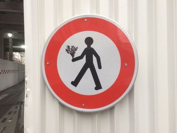 Close-up of arrow sign on road