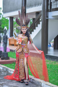 Full length of woman standing at temple