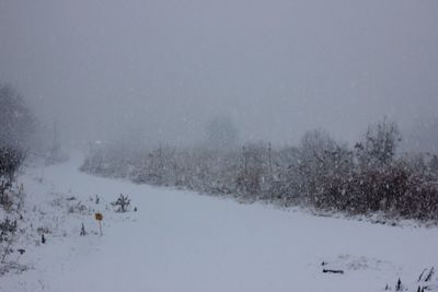 Scenic view of frozen landscape against clear sky