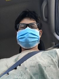 Portrait of a woman sitting in car