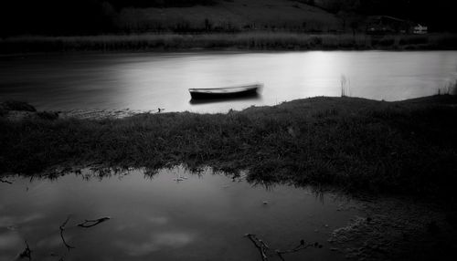 Boat moored in lake