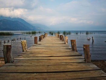 Pier over sea against sky