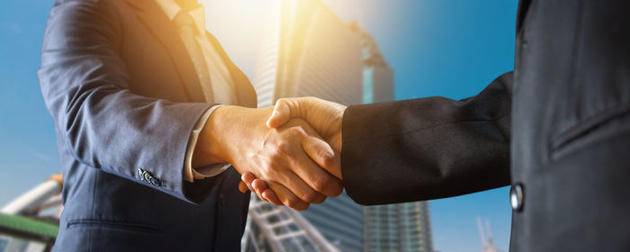 Midsection of businessman gesturing