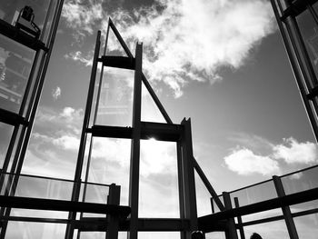 Low angle view of bridge against sky in city