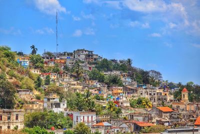 Houses in town against sky