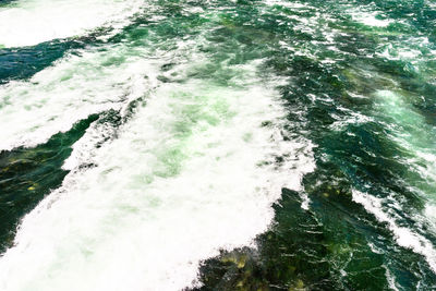 High angle view of water flowing over sea