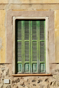 Closed window of old building